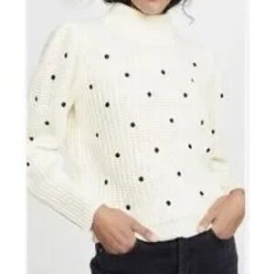 Elegant White Turtleneck Sweater with Black Dots